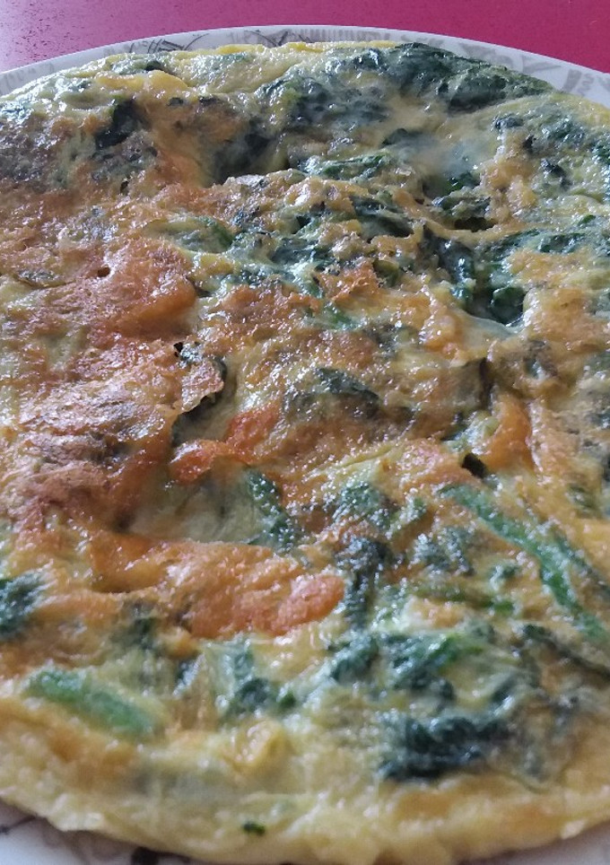 Una foto de Tortilla de espinacas y queso de rulo