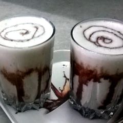 A picture of Banana and chocolate smoothie with cinnamon.
