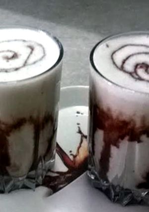 A picture of Banana and chocolate smoothie with cinnamon.