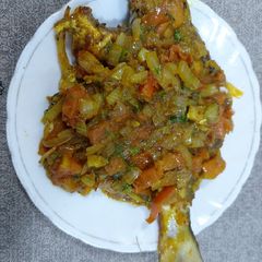 A picture of Fish onion and tomato masala chatpaty fish.