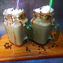 A picture of Chocolate, ice-cream milkshake.