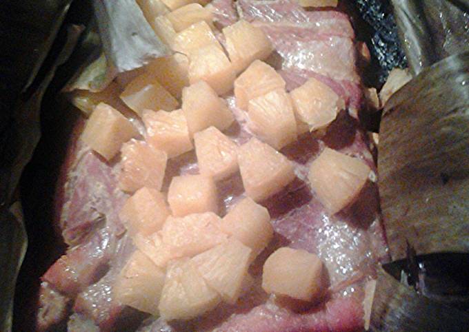 Pineapple pork ribs cooked in banana leaves