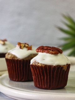 A picture of Banana Nuts Muffins with Greek Yogurt Icing.