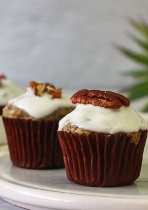 A picture of Banana Nuts Muffins with Greek Yogurt Icing.