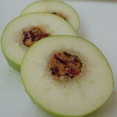 A picture of Apple With Peanut Butter And Cranberries.