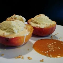 A picture of AMIEs Peaches with Ice cream and Apricot sauce.
