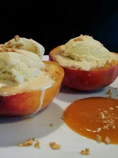 A picture of AMIEs Peaches with Ice cream and Apricot sauce.