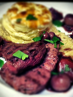A picture of Rump Steak with wholegrain mustard dauphinoise, onion thyme puree and bourguignon sauce.