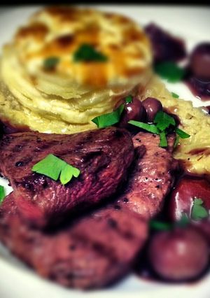 A picture of Rump Steak with wholegrain mustard dauphinoise, onion thyme puree and bourguignon sauce.