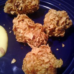 A picture of corn flaked fried chicken.