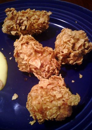 A picture of corn flaked fried chicken.