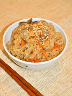A picture of Rice with Maitake Mushrooms Seasoned with Simmered Pork Belly Sauce.