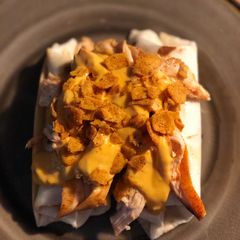 A picture of STEAK and SHREDDED CHICKEN BURRITOS WITH MELTED CHEESE/FRITOS: JAYS SMOTHERED BURRITO.