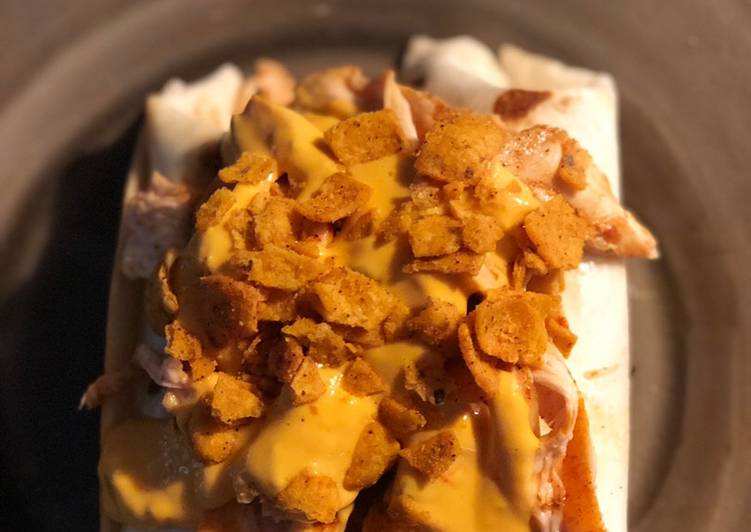 STEAK and SHREDDED CHICKEN BURRITOS WITH MELTED CHEESE/FRITOS: JAYS SMOTHERED BURRITO