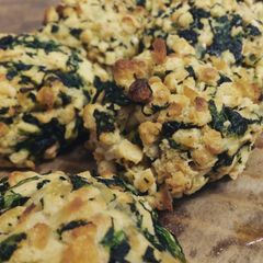 A picture of backed spinach dumplings.