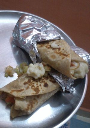 A picture of Potato wraps with cucumber relish and caramalised onions.