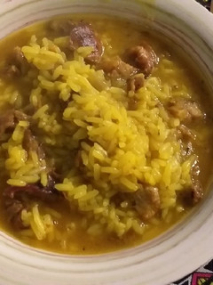 Una foto de Guiso de arroz con asadito