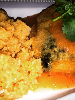 A picture of Beef & Cheese Stuffed Chile Rellenos with Red Sauce.
