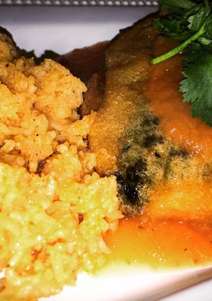 A picture of Beef & Cheese Stuffed Chile Rellenos with Red Sauce.