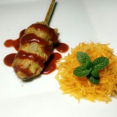 A picture of Minced meat on a stick.