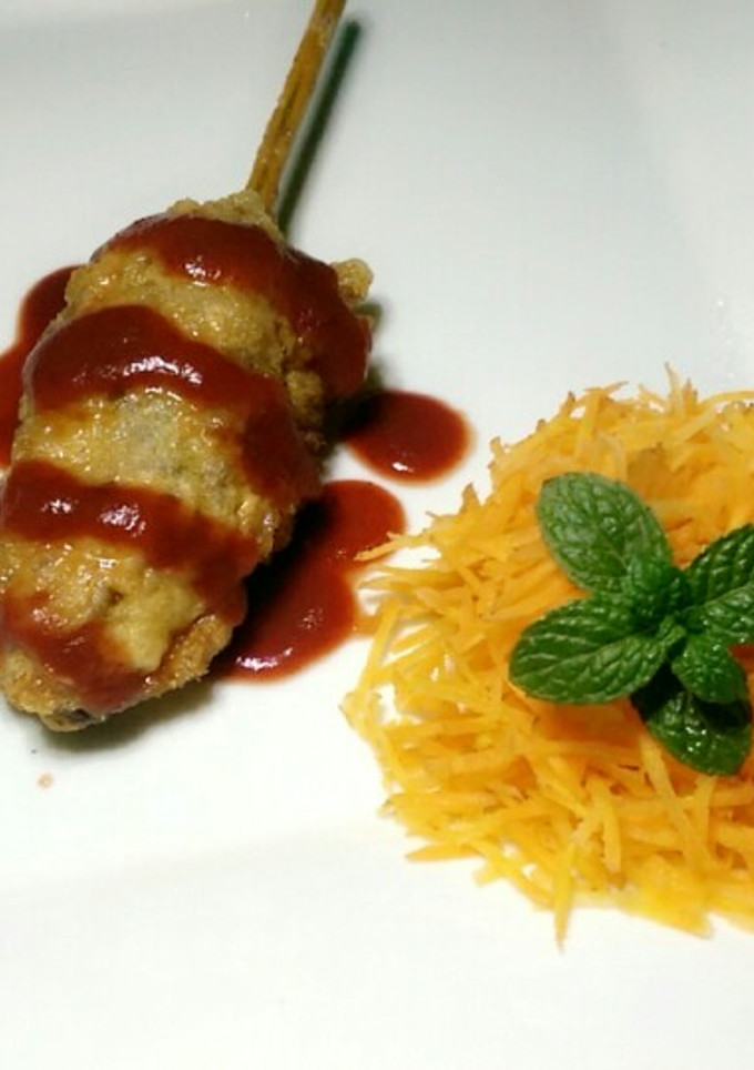 A picture of Minced meat on a stick.