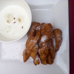 A picture of Rasmalai and twisted doughnut.