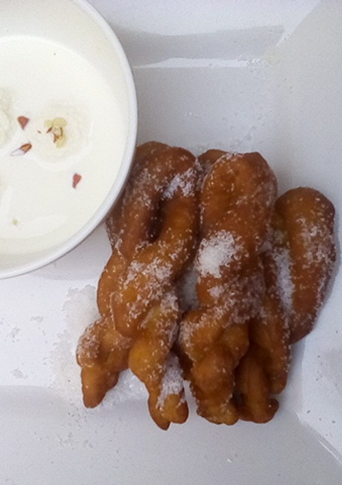 A picture of Rasmalai and twisted doughnut.