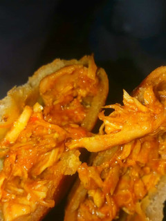 A picture of Lebanese long bread with chicken source.