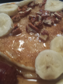A picture of Banana and pecan pancakes.
