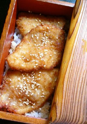 A picture of Chicken Breast Cutlets Over Rice Coated with Starch + Bread Crumbs.