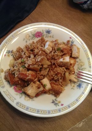 A picture of Rice, chicken, potatoes and Sauteéd veggies in soy sauce.