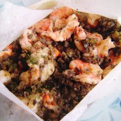 A picture of Shrimp en Papillote with Mushroom Sauce.