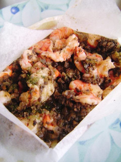 A picture of Shrimp en Papillote with Mushroom Sauce.