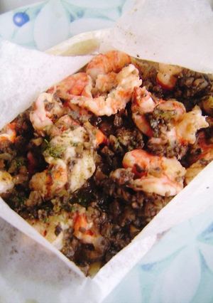 A picture of Shrimp en Papillote with Mushroom Sauce.