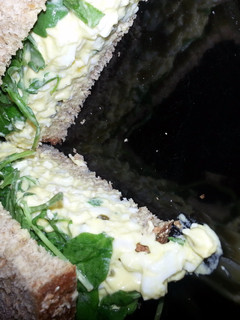 A picture of Egg Salad and Arugula Sandwhich.