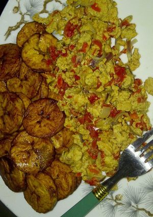 A picture of Scramble eggs and fried plantain.