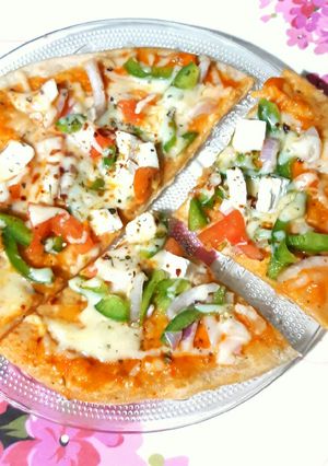 A picture of Whole Wheat Thin Crust Tava Pizza.