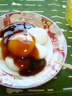 A picture of Delicious Mitarashi Dango With Thick Sauce.