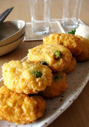 A picture of Light and Fluffy Fritters With Edamame and Camembert Cheese.