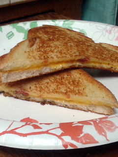 A picture of Grilled cheese and bacon sandwich.