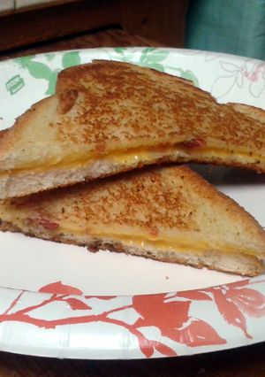 A picture of Grilled cheese and bacon sandwich.