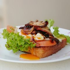 A picture of Black Pepper Roasted Pork And Egg Sandwich.