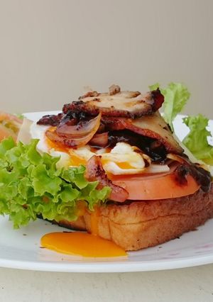 A picture of Black Pepper Roasted Pork And Egg Sandwich.