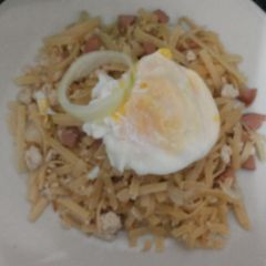 A picture of Fettucini with sausage and chicken.