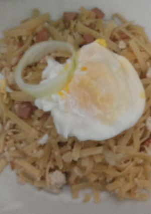 A picture of Fettucini with sausage and chicken.