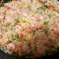 A picture of Asian inspired rice with shrimp.