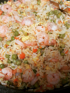 A picture of Asian inspired rice with shrimp.