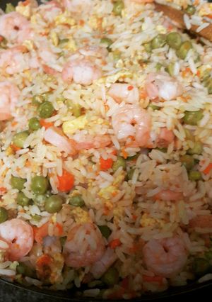 A picture of Asian inspired rice with shrimp.