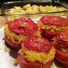 A picture of AMIEs TOMATOES STUFFED with BASIL-FLAVORED rice.