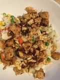 Fried chicken and rice with vegetables - Chinese cuisine influence 